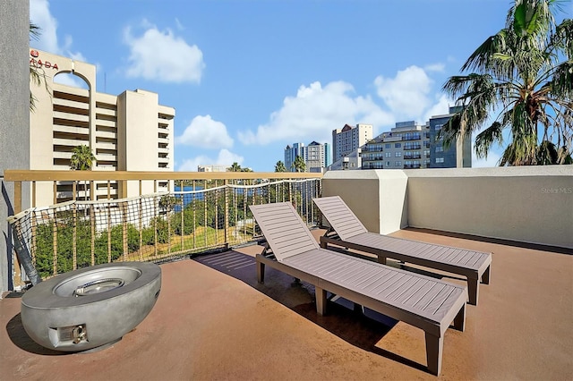 view of patio featuring a view of city and a balcony