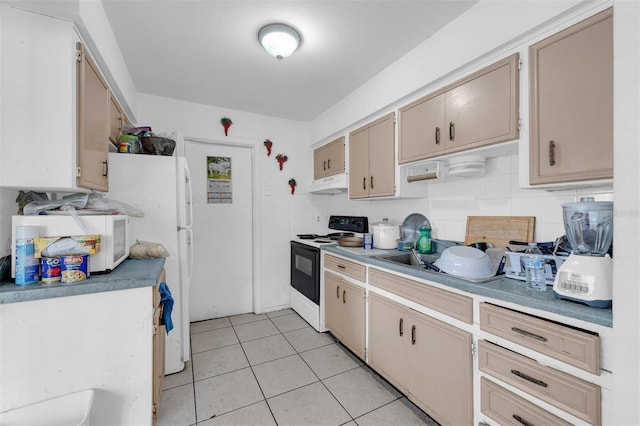 kitchen featuring backsplash, under cabinet range hood, light countertops, light tile patterned floors, and range with electric stovetop