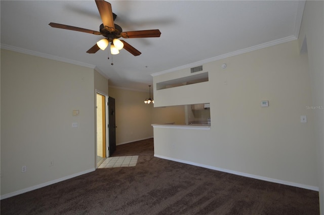 unfurnished room featuring ceiling fan with notable chandelier, baseboards, crown molding, and carpet