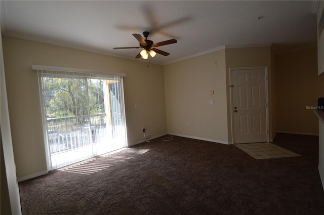 carpeted spare room featuring baseboards, ceiling fan, and crown molding