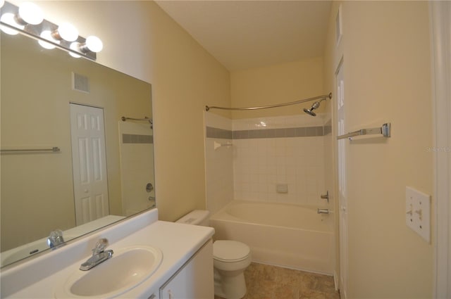 bathroom featuring visible vents, toilet, vanity, and washtub / shower combination