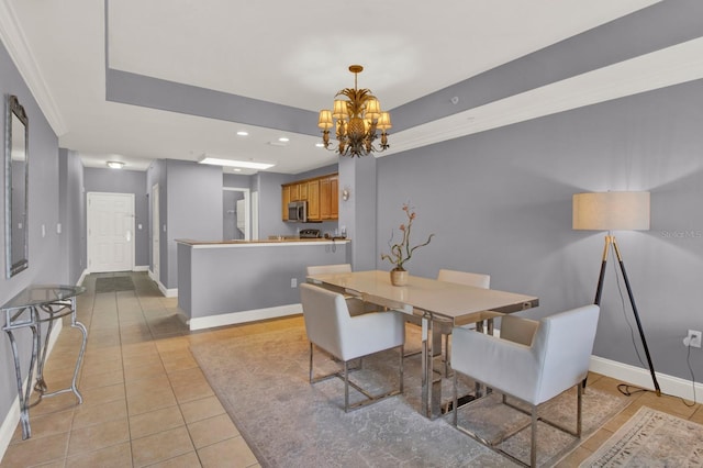 dining room featuring a tray ceiling, recessed lighting, an inviting chandelier, light tile patterned flooring, and baseboards