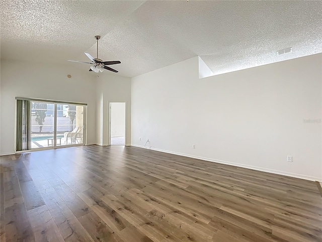 empty room featuring dark wood-style floors, baseboards, a textured ceiling, and ceiling fan