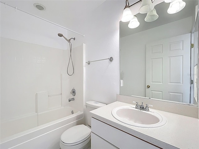 bathroom with shower / bathtub combination, toilet, and vanity