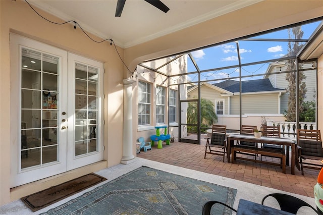 sunroom featuring ceiling fan