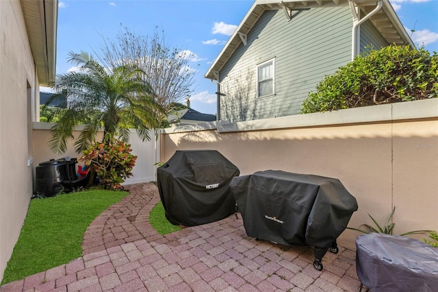 view of patio / terrace featuring area for grilling and fence