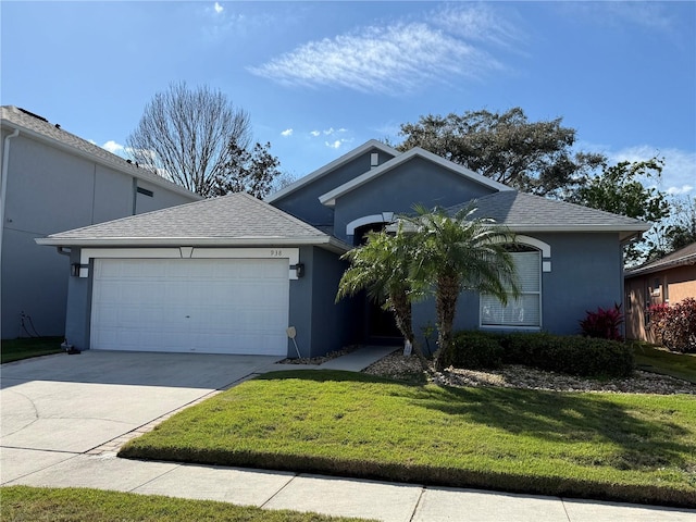 single story home featuring stucco siding, driveway, a front yard, and an attached garage