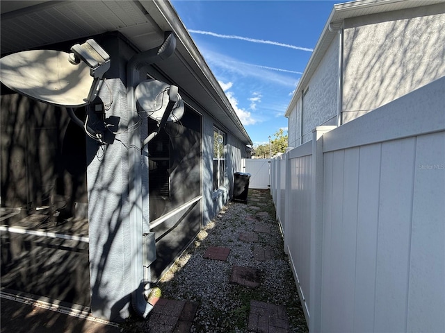 view of home's exterior featuring fence