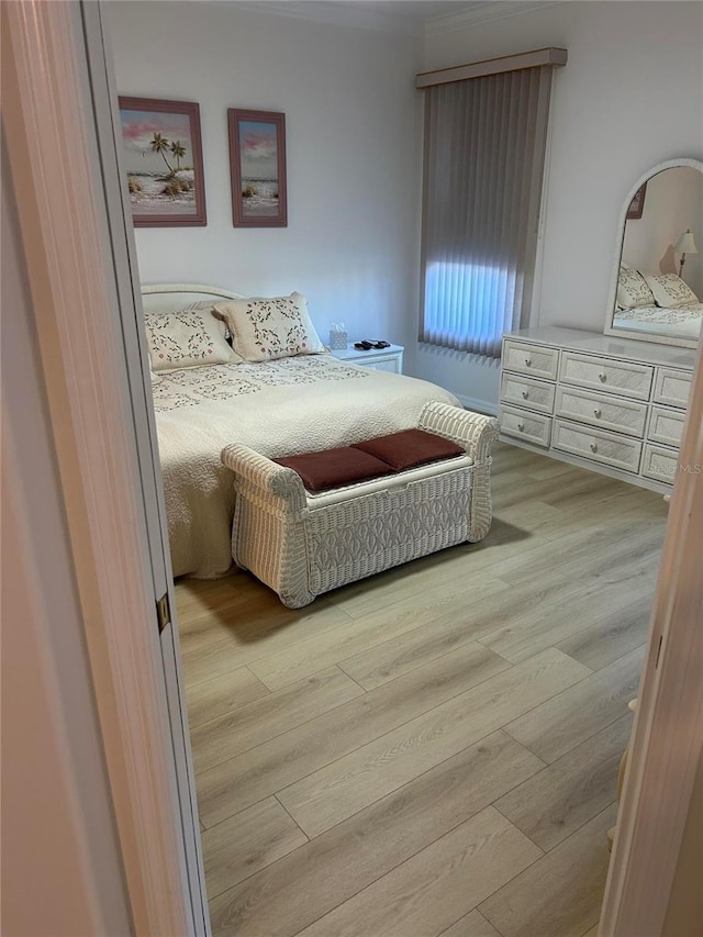 bedroom with wood finished floors