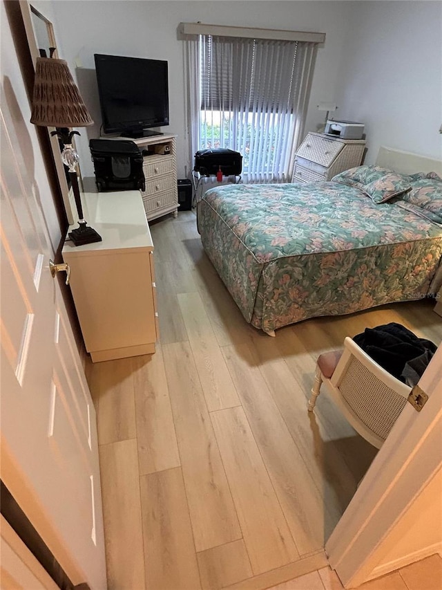 bedroom featuring light wood-style flooring