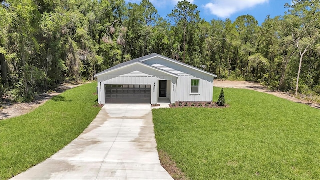 13457 SW 53rd St, Ocala, FL 34481 - view of front of house featuring board and batten siding, concrete driveway, a front yard, and a garage