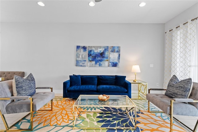 living area with recessed lighting and baseboards