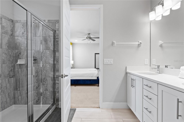 bathroom featuring a shower stall, ensuite bath, vanity, and a ceiling fan