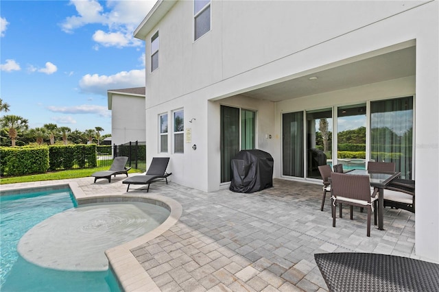 view of swimming pool with a fenced in pool, fence, a grill, and a patio area
