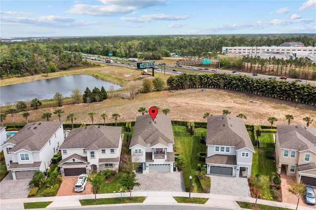 aerial view with a residential view and a water view