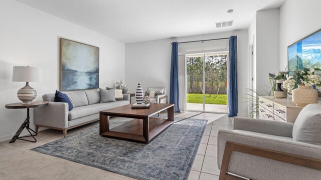 132 Adventure Ave, Davenport, FL 33837 - tiled living room with visible vents and baseboards