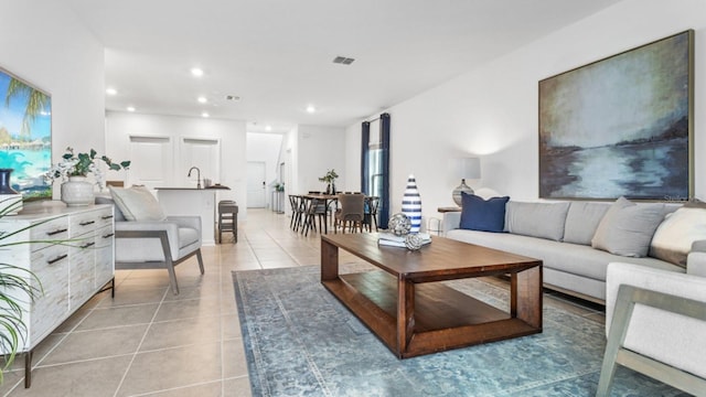 132 Adventure Ave, Davenport, FL 33837 - living area featuring light tile patterned floors, recessed lighting, visible vents, and plenty of natural light