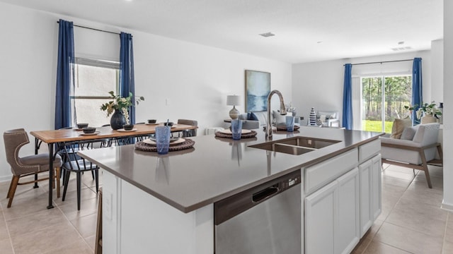132 Adventure Ave, Davenport, FL 33837 - kitchen with light tile patterned floors, a sink, white cabinets, dishwasher, and open floor plan