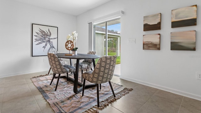 dining space featuring baseboards