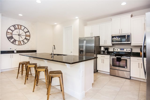 7463 Marker Ave, Kissimmee, FL 34747 - kitchen with white cabinetry, recessed lighting, appliances with stainless steel finishes, and a sink