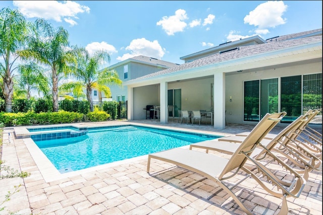 7463 Marker Ave, Kissimmee, FL 34747 - view of swimming pool featuring outdoor dining space, a patio, fence, area for grilling, and a pool with connected hot tub