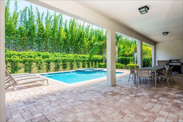 7463 Marker Ave, Kissimmee, FL 34747 - view of swimming pool featuring outdoor dining space, a patio area, a pool with connected hot tub, and grilling area