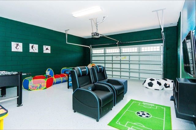 7463 Marker Ave, Kissimmee, FL 34747 - game room with speckled floor and a garage