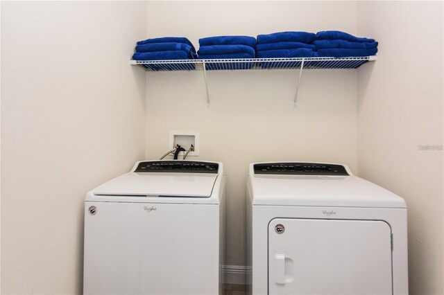 7463 Marker Ave, Kissimmee, FL 34747 - clothes washing area with washer and dryer and laundry area