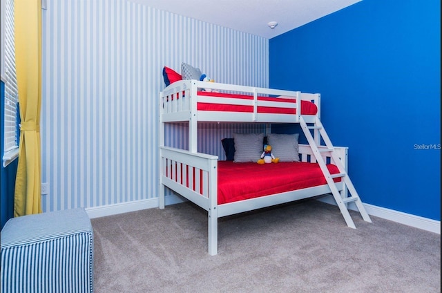 7463 Marker Ave, Kissimmee, FL 34747 - carpeted bedroom featuring baseboards