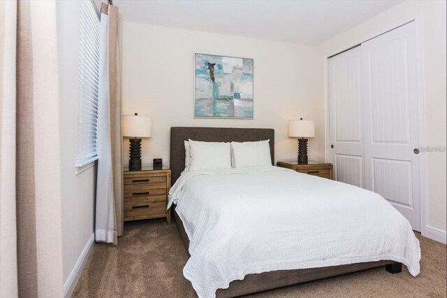 7463 Marker Ave, Kissimmee, FL 34747 - carpeted bedroom with a closet and baseboards
