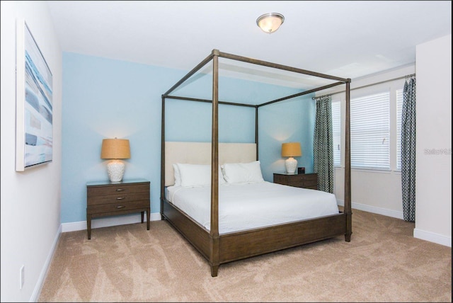 7463 Marker Ave, Kissimmee, FL 34747 - bedroom featuring light carpet and baseboards