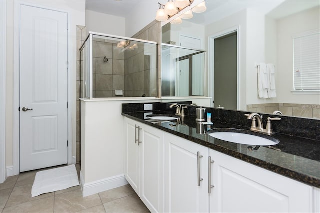 7463 Marker Ave, Kissimmee, FL 34747 - full bath featuring tile patterned floors, double vanity, a stall shower, and a sink