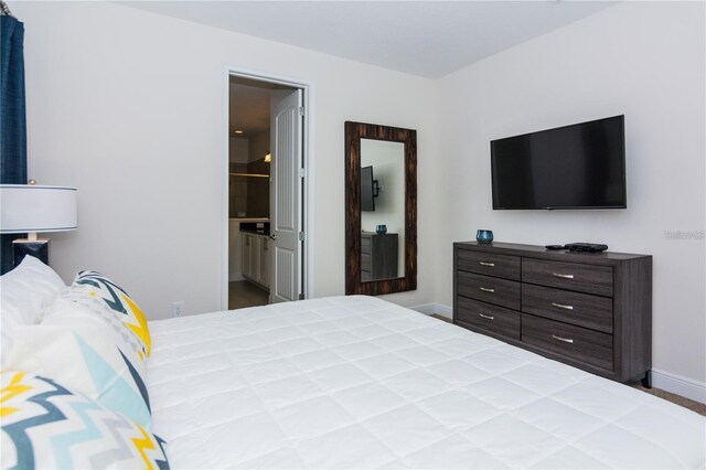 7463 Marker Ave, Kissimmee, FL 34747 - bedroom featuring baseboards and ensuite bath