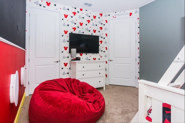 7463 Marker Ave, Kissimmee, FL 34747 - bedroom with visible vents, carpet flooring, and wallpapered walls