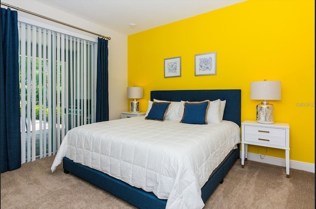 7463 Marker Ave, Kissimmee, FL 34747 - carpeted bedroom featuring access to exterior and baseboards