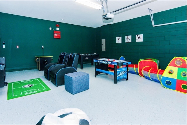 7463 Marker Ave, Kissimmee, FL 34747 - recreation room featuring a garage and speckled floor