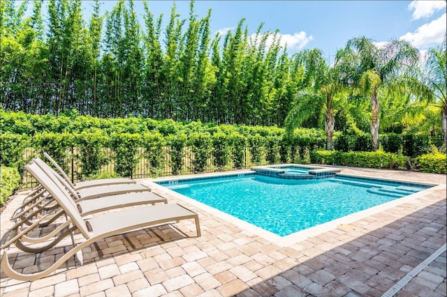7463 Marker Ave, Kissimmee, FL 34747 - view of pool featuring a patio, fence, and a pool with connected hot tub