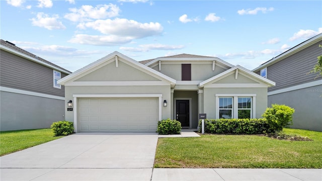 view of front of house featuring stucco siding, driveway, a front yard, and an attached garage