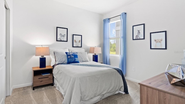 carpeted bedroom with baseboards