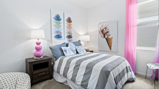 bedroom with baseboards and carpet flooring