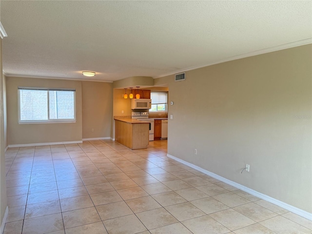 unfurnished living room with visible vents, crown molding, baseboards, light tile patterned floors, and a textured ceiling