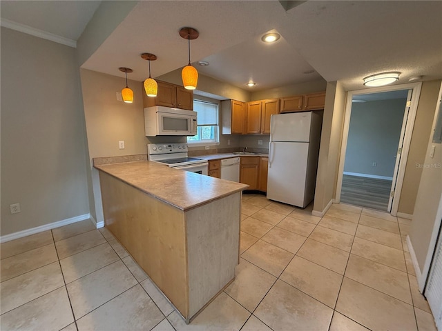 kitchen featuring light tile patterned floors, baseboards, white appliances, and a peninsula