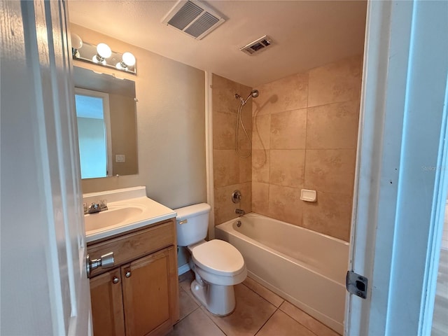 bathroom with tile patterned floors, visible vents, toilet, and vanity