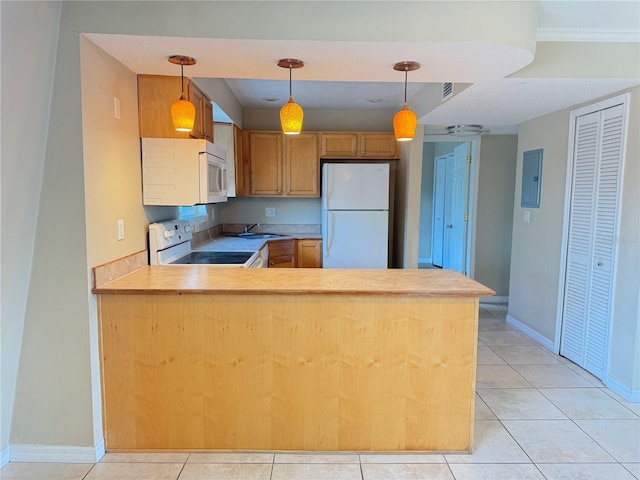 kitchen featuring a sink, white appliances, a peninsula, light countertops, and light tile patterned floors