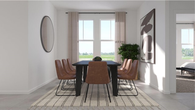 dining area featuring light tile patterned floors, baseboards, and a wealth of natural light