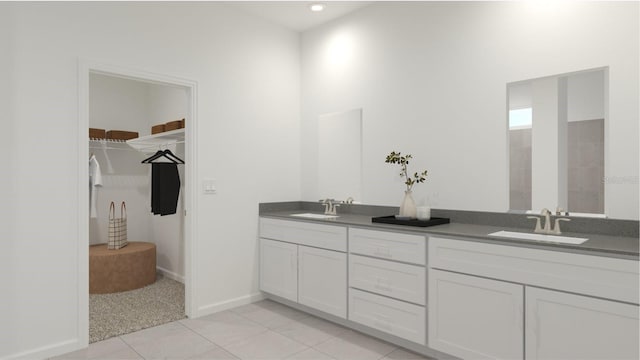 full bathroom with tile patterned flooring, a sink, a spacious closet, and double vanity