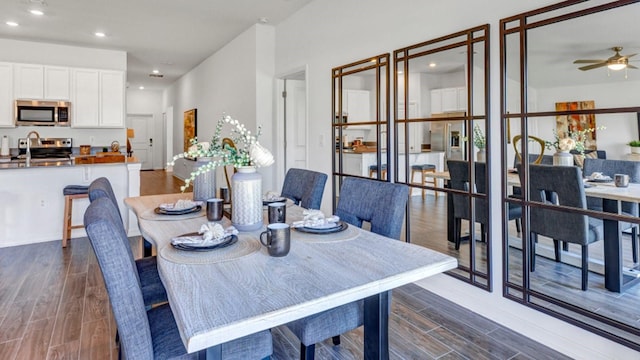 dining space with ceiling fan, recessed lighting, and wood finish floors