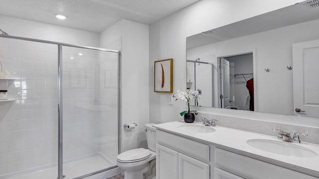 full bath featuring a sink, visible vents, toilet, and a stall shower