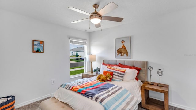 bedroom featuring baseboards, a ceiling fan, and carpet flooring