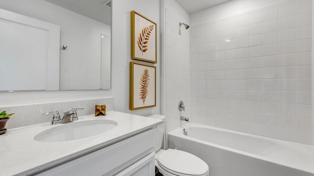 bathroom with shower / bath combination, toilet, and vanity